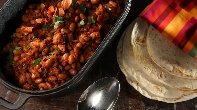 Charro beans get their flavor from bacon, Mexican chorizo and jalapeno. (Abel Uribe/Chicago Tribune/TNS)