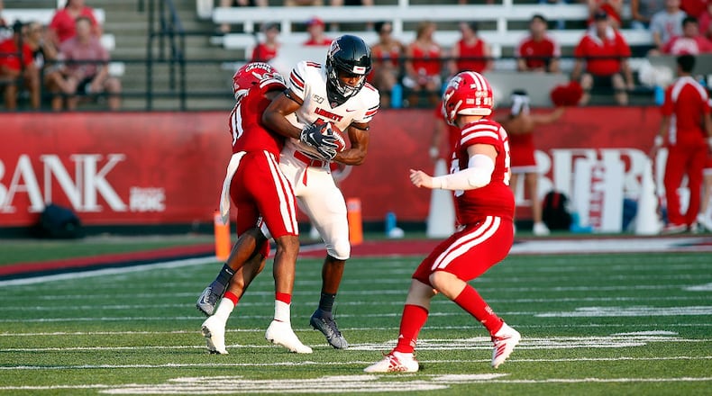 Liberty wide receiver Antonio Gandy-Golden (11) is tackled by Louisiana-Lafayette defensive back Michael Jacquet III (11), Saturday, September 7, 2019, in Lafayette, La. (AP Photo/Tyler Kaufman)