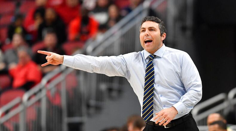 Georgia Tech head coach Josh Pastner signals to his team during the first half of an NCAA college basketball game against Louisville in Louisville, Ky., Wednesday, Feb. 1, 2023. (AP Photo/Timothy D. Easley)