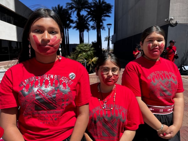 This photo provided by the Phoenix Indian Center shows from left, Yaretzi Ortega, Demetria Collins and Avery Hubbell, members of the Future Inspired Native American Leaders Youth Council, during a Missing and Murdered Indigenous People awareness event in Phoenix, Arizona, on Saturday, May 3, 2025. (Levi Long/Phoenix Indian Center via AP)