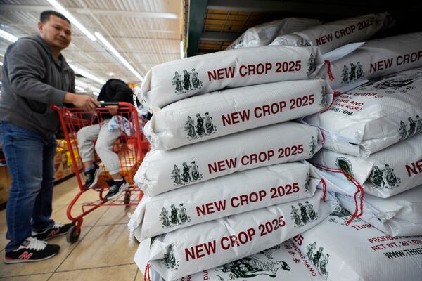 Imported bags of rice sit for sale at the Hiep Thai grocery store in Garland, Texas, Monday, April 7, 2025. (AP Photo/LM Otero)