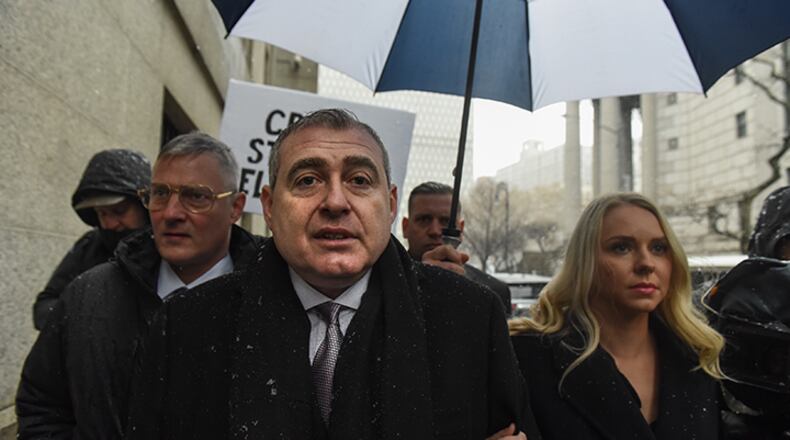 Lev Parnas arrives with his wife Svetlana Parnas at federal court on December 2, 2019 in New York City. Parnas, an associate of President Trump's personal lawyer Rudy Giuliani, was arrested in October on charges of illegally funneling money to a pro-Trump election committee and other politicians.