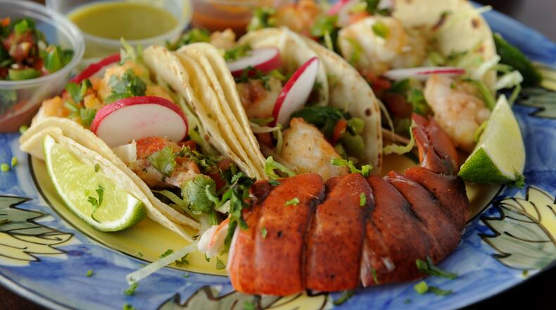 The lobster taco plate with radish, cilantro, lime, rice and beans at Boca Mexican Grill in Smyrna.