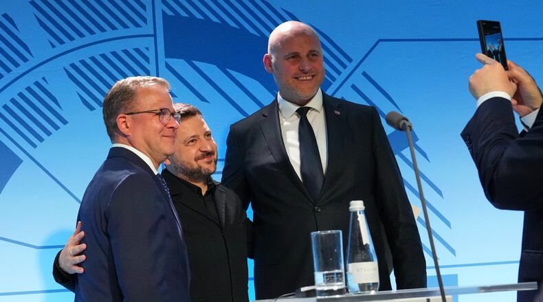 From left, Finnish Prime Minister Petteri Orpo, Ukraine's President Volodymyr Zelenskyy and Latvia's Prime Minister Andris Kulbergs pose for photo after a news conference at the Nordic and Baltic countries meeting in Tallinn, Estonia, Tuesday, June 9, 2026. (AP Photo/Sergei Grits)