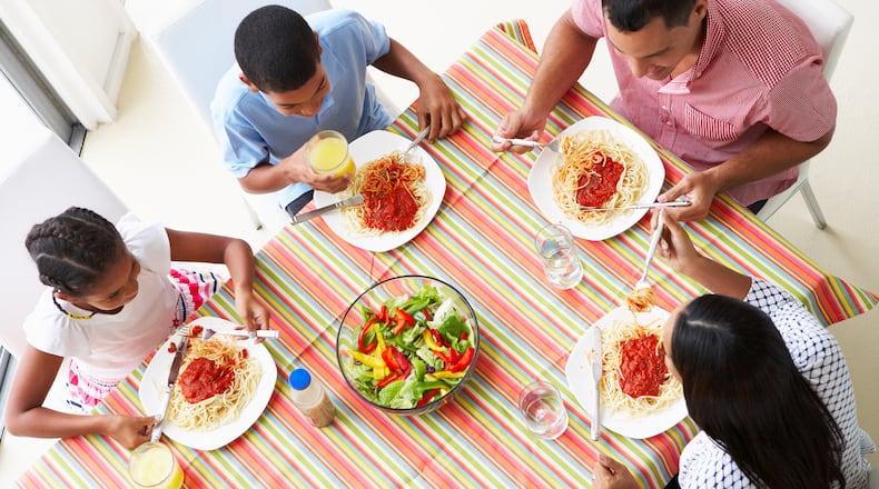 Sitting down for a meal together lowered their family’s stress level, according to 91% of parents who responded to a nationwide survey by the American Heart Association. (Dreamstime/TNS)