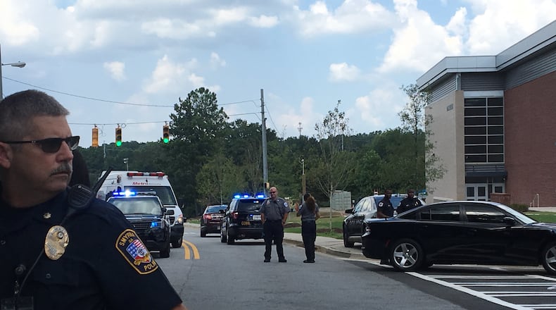 In a guest column, a former Cobb school board member and a high school student maintain an increased police presence in U.S. schools has not decreased school shootings. (AJC file photo)