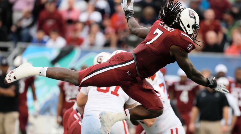 Jadeveon Clowney #7 of the South Carolina Gamecocks works out on the field before the start of their game against the Wisconsin Badgers at the Capital One Bowl on January 1, 2014 in Orlando, Florida. *** Local Caption *** Jadeveon Clowney Jadeveon Clowney will fly off draft board early, but maybe not to Houston. (Scott Halleran/Getty Images)