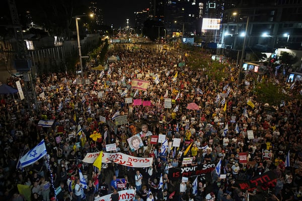 People take part in a protest demanding the end of the war and immediate release of hostages held by Hamas in the Gaza Strip, and against Prime Minister Benjamin Netanyahu's government in Tel Aviv, Israel, Saturday, June 7, 2025. (AP Photo/Ohad Zwigenberg)