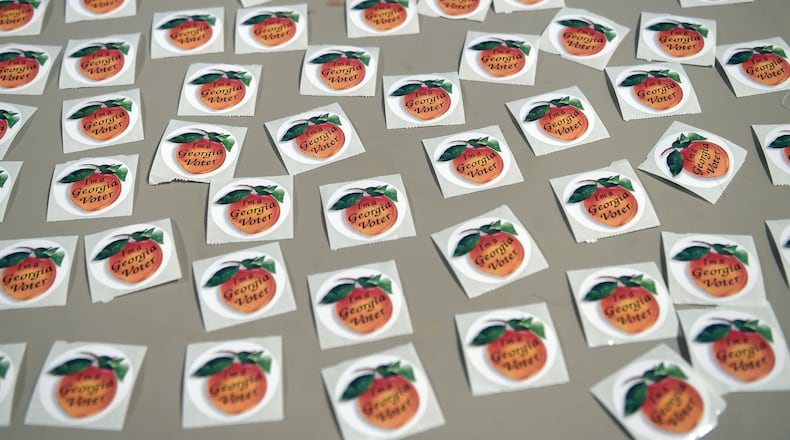 Voting stickers await DeKalb County voters at the polls on Election Day at the Crossroads Presbyterian Church in Stone Mountain on Tuesday. Kent D. Johnson, kdjohnson@ajc.com