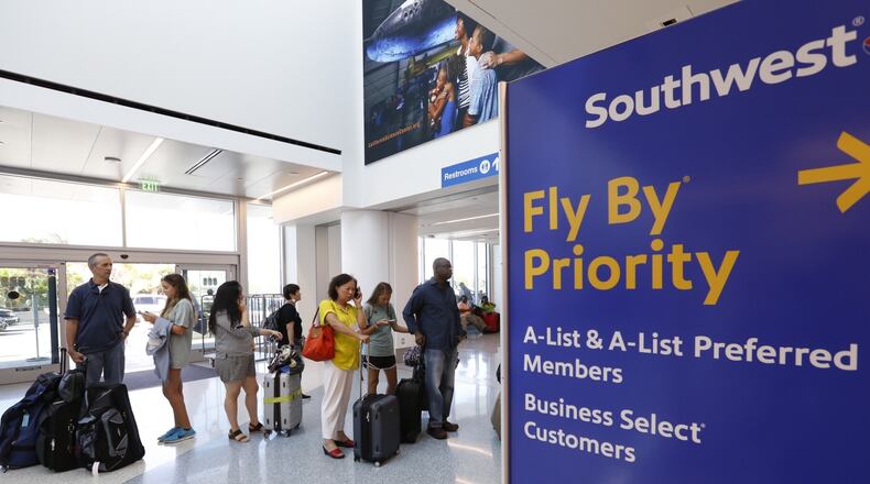 A line of passengers at the Southwest Airlines ticket counter on July 21, 2016, in Los Angeles. The nation's largest domestic carrier, Southwest is planning to add routes to Hawaii, and market shifts are likely in store. (Al Seib/Los Angeles Times/TNS)