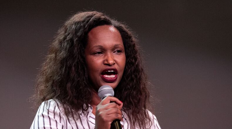 Anamaliya, author of “Terrorized in Rwanda: Healed by Grace,” speaks to the crowd during Rally for Resettlement, a solidarity event for refugees and agencies, held at Clarkston International Bible Church in Clarkston, Georgia, on Saturday, Sept. 28, 2019. (Photo: Rebecca Wright / Special to the AJC)