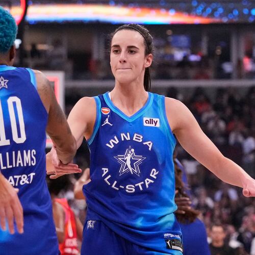 Team Spoon's Caitlin Clark, right, celebrates with Courtney Williams (10) after their team defeated Team Coop in a WNBA All-Star basketball game in Chicago, Saturday, July 25, 2026. (AP Photo/Nam Y. Huh)