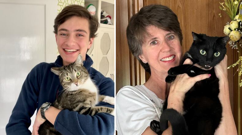 A colony of stray cats at the Shadowood Office Park on Powers Ferry Road have been cared for by property managers and tenants over the past five years. Scooter (at left) was the first cat trapped and placed in a forever home. He is shown with Max Rodbell, son of Jonathan Rodbell, partner and co-founder of Atlanta Property Group. Cindy Worley (at right), a longtime tenant of Shadowood Office Park, holds Little One, one of the community cats found on the property. Courtesy of the Atlanta Property Group.