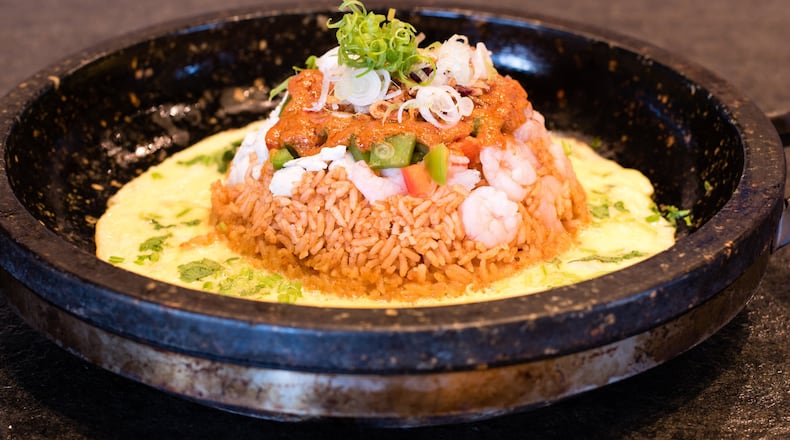 The Rolling Hot Pot at Food Terminal is an elaborate family-style take on fried rice. CONTRIBUTED BY HENRI HOLLIS