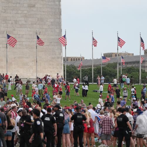 Law enforcement secure the area as people evacuate because of incoming storms that will delay the program at a Salute to America Independence Day event honoring the nation's 250th anniversary, Saturday, July 4, 2026, on the National Mall in Washington. (AP Photo/Alex Brandon)