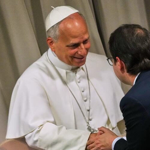 Pope Leo XIV, left, greets Anthropic co-founder Christopher Olah during the presentation of the Pope's first encyclical, "Magnifica humanitas: On Safeguarding the Human Person in the Time of Artificial Intelligence," at the Vatican, Monday, May 25, 2026. (AP Photo/Alessandra Tarantino)