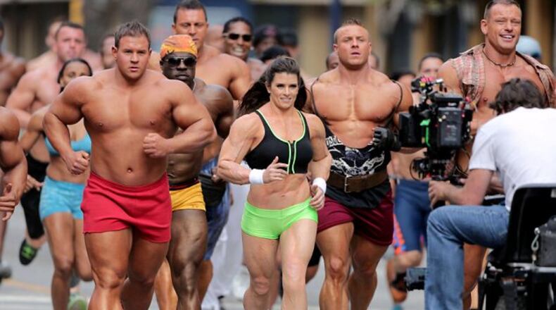 Danica Patrick sports a "muscle suit" in her Super Bowl GoDaddy.