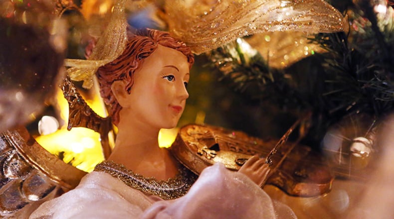 An angel themed ornament on the "Angel tree" in the family room of the Joyce  Zerges household in this AJC file photo from Nov. 11, 2014. She has had parts of her house professionally decorated for Christmas and has worked with the decorators and others at M.C Twinklin's Christmas shop.