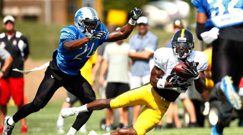 Pittsburgh Steelers wide receiver Antonio Brown (84) catches a pass in front of Detroit Lions cornerback Nevin Lawson (24) during an NFL scrimmage at the Steelers' NFL football training camp in Latrobe, Pa., on Tuesday, Aug. 9, 2016. (AP Photo/Jared Wickerham)