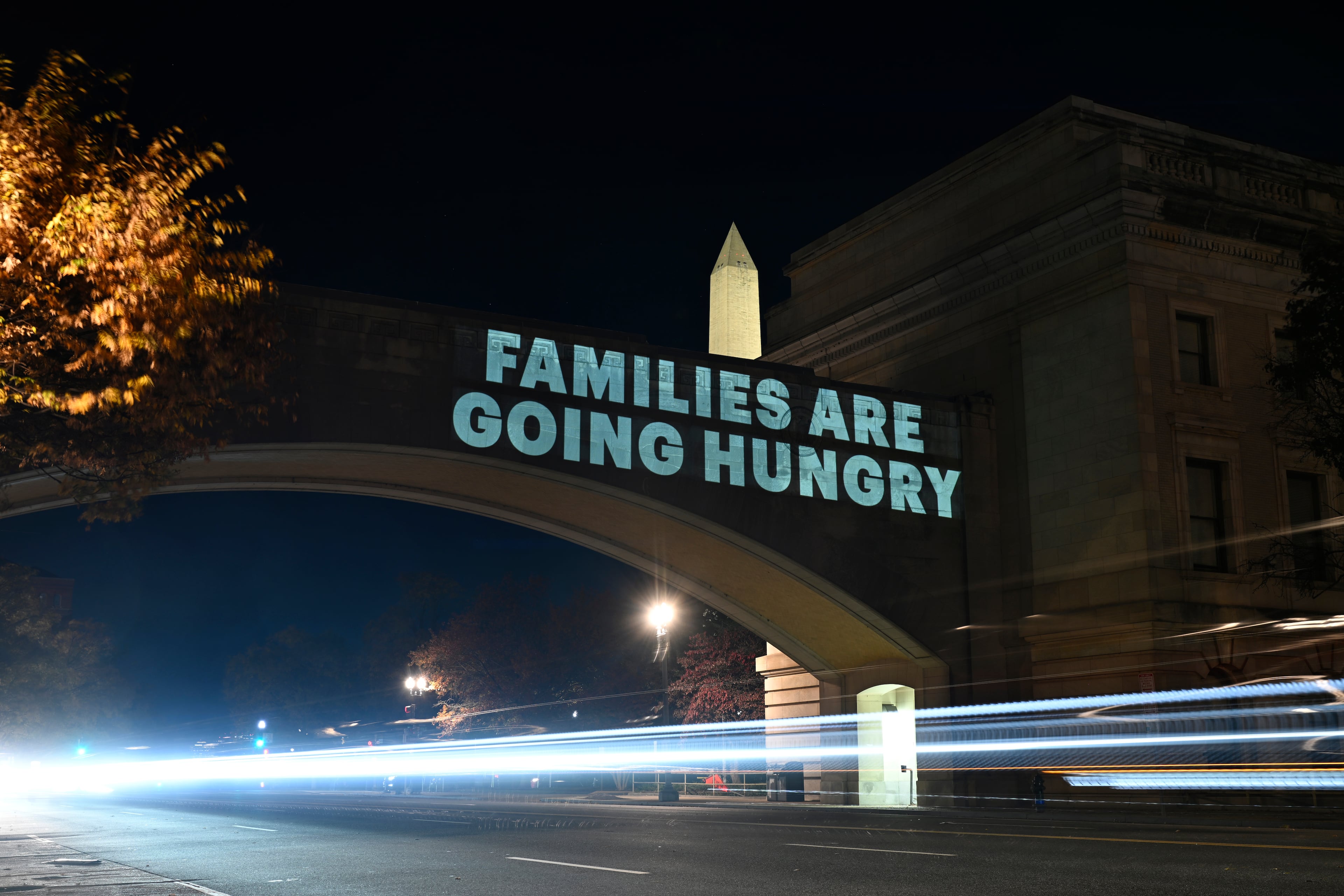 A message was projected on the U.S. Department of Agriculture building in Washington after the Trump administration said it would only partially fund a federal food aid program during the shutdown. (John McDonnell/AP)