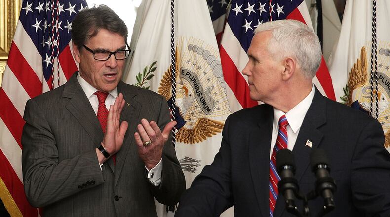 WASHINGTON, DC - MARCH 02: U.S. Vice President Mike Pence (R) speaks during a swearing-in ceremony, as Rick Perry (L) looks on in the Vice President's ceremonial office at Eisenhower Executive Office Building March 2, 2017 in Washington, DC. Perry has been sworn in as the Energy Secretary for the Trump Administration. (Photo by Alex Wong/Getty Images)