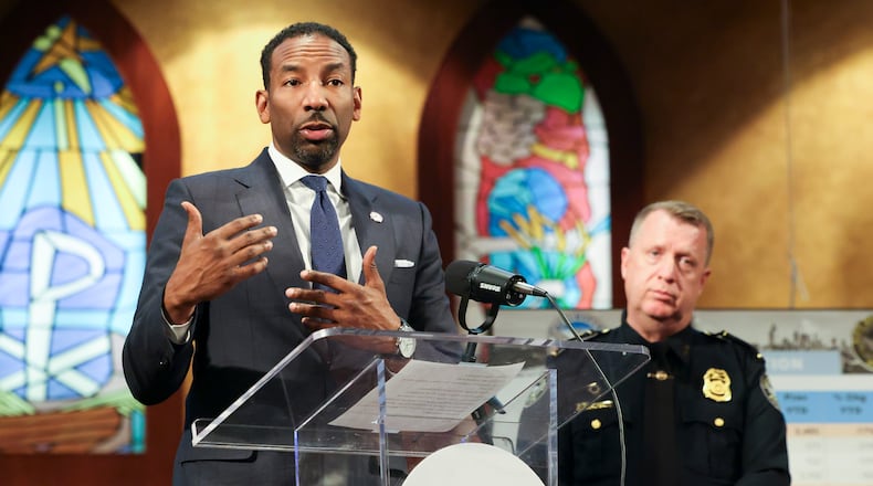 Atlanta Mayor Andre Dickens spoke about the city's crime rate during a news conference in January next to Atlanta police Chief Darin Schierbaum.