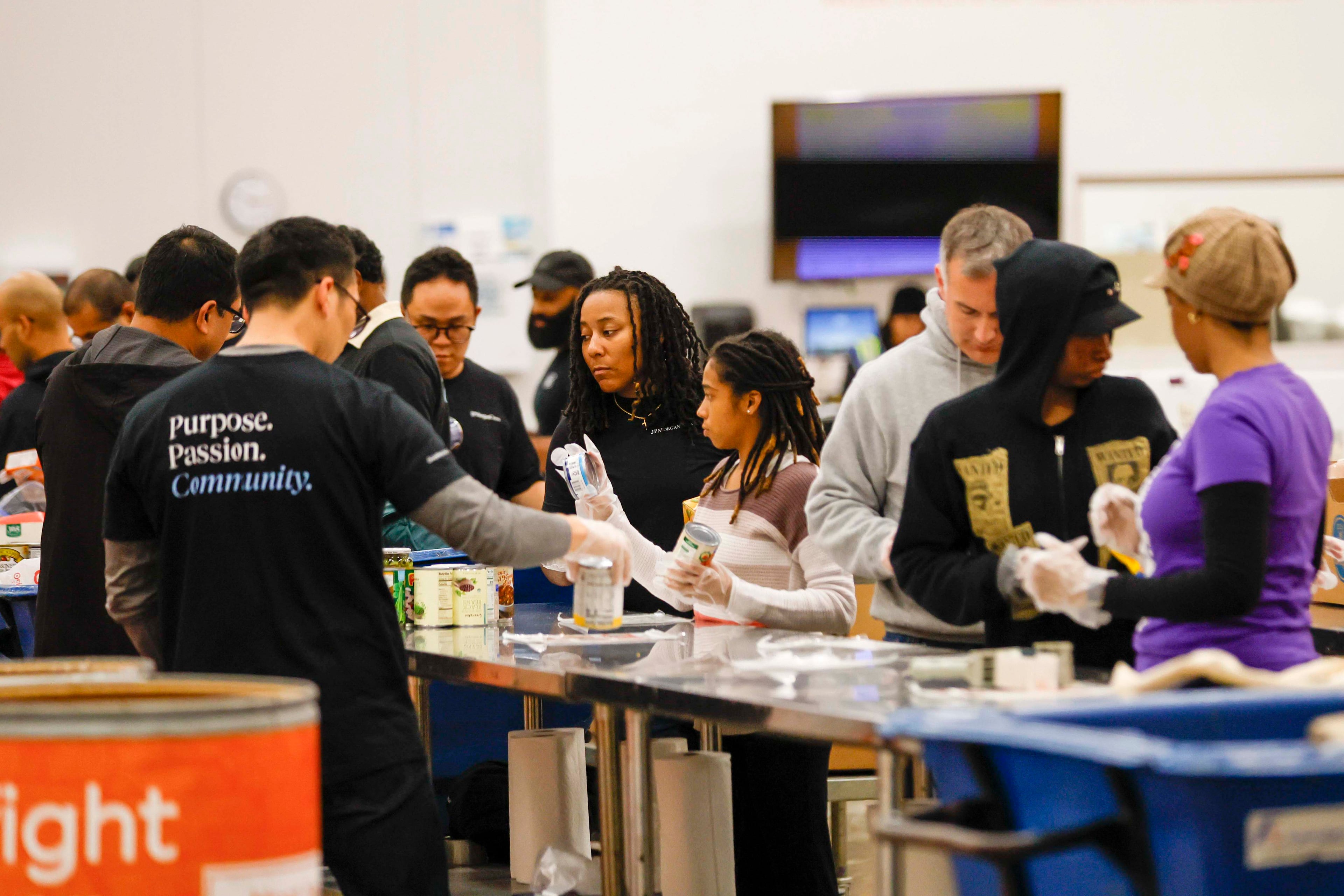 Volunteers pack food at the Hunger Action Center at the Atlanta Community Food Bank. Around the South, people are taking care of their neighbors who lost SNAP benefits Saturday.