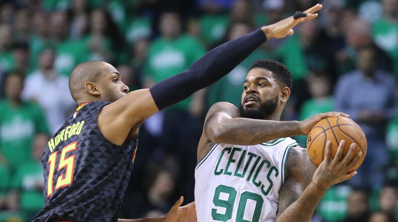 042216 BOSTON: Hawks center Al Horford defends against Celtics forward Amir Johnson in their NBA Eastern Conference first round playoff basketball game at TD Garden on Friday, April 22, 2016, in Boston. Curtis Compton / ccompton@ajc.comon