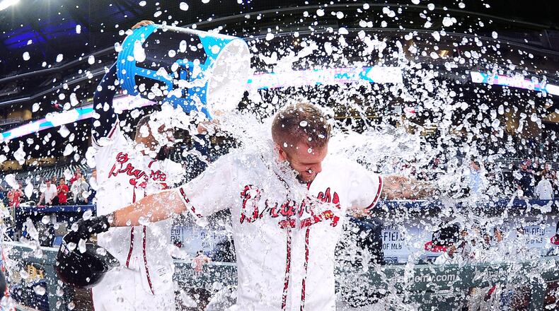 Matt Adams gets a celebratory soaking after driving in a game-winning run against Pittsburgh at SunTrust Park. (Scott Cunningham/Getty Images)