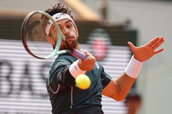 Italy's Lorenzo Musetti plays a shot against Frances Tiafoe of the U.S. during their quarterfinal match of the French Tennis Open at the Roland-Garros stadium in Paris, Tuesday, June 3, 2025. (AP Photo/Aurelien Morissard)