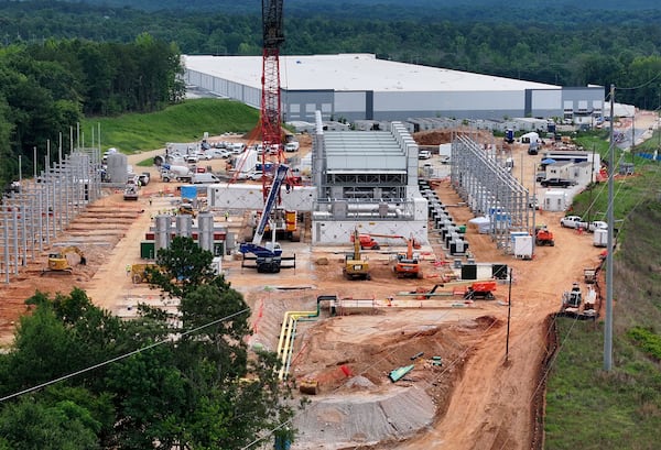 This aerial view shows off-grid generators being installed in Covington, with the data center in the background. (Hyosub Shin/AJC)