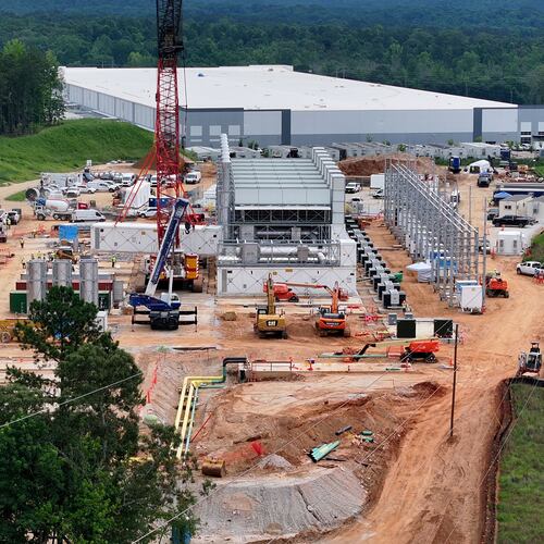 Aerial view of off-grid generators being installed, with the data center in the background, on Thursday, June 25, 2026, in Covington. A data center near Social Circle plans to get its primary power supply from a set of off-grid generators, the first setup of its kind in Georgia. But the company behind the power project is already installing its equipment, despite never obtaining proper permits from the state, a move environmental advocates say raises serious questions about oversight of data centers cropping up across Georgia. (Hyosub Shin/AJC)