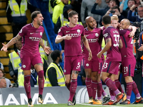 FILE - Manchester City's scorer Kevin De Bruyne, second right, and his teammates celebrate the opening goal during their English Premier League soccer match between Chelsea and Manchester City at Stamford Bridge stadium in London, Saturday, Sept. 30, 2017. (AP Photo/Frank Augstein, file)