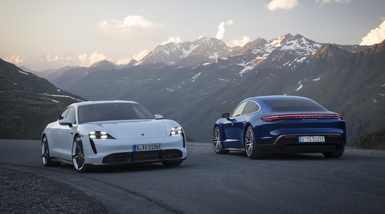 Porsche presented its first fully-electric sports car to the public Wednesday with a world premiere held simultaneously on three continents. The Taycan Turbo S (left) and the Taycan Turbo (right).