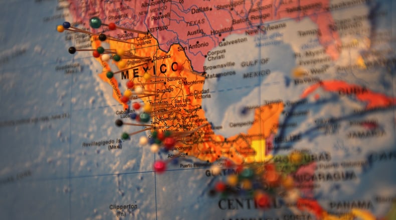 LITTLETON, CO - MAY 10: Pins in a map mark the origins of immigrants who have received assistance at the Immigrant Resources Center on May 10, 2011 in Littleton, Colorado. The center has more than 400 community volunteers assisting the immigrant community south of Denver. The majority of immigrants visiting the center are from Latin America, although increasingly more Asians have sought assisance ahead of their U.S. citizenship exam. In a speech that U.S. President Barack Obama gave on the U.S.-Mexico border he provoked the Republican party to take on a comprehensive immigration overhaul. The program, established six-years ago, is intended to help with the integration of immigrants into the community. (Photo by John Moore/Getty Images)