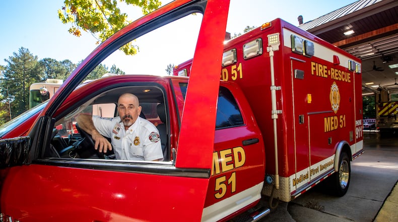Chattahoochee Hills Fire Chief Greg Brett invested in an ambulance several years ago to provide care in his South Fulton community where Grady is awarded transport license but with more than 30 minutes before arrival time, cannot provide for acute life and death situations in the area. Chief Brett is at the fire station Thursday, Oct 6, 2022 with the ambulance that transported 2 patients in September alone and was paid for partly by the community.  (Jenni Girtman for The Atlanta Journal-Constitution)