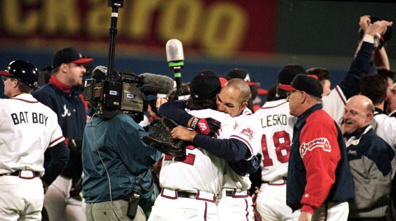 David Justice #23 of the Atlanda Braves hugs his teammate after game six of the World Series against the Cleveland Indians at the Fulton County Stadium in Atlanta, Georgia.