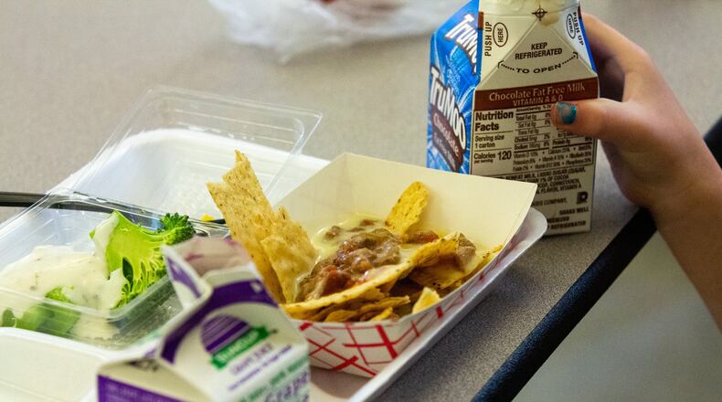 Students at Hickory Hills Elementary School in Marietta, Georgia, enjoy their lunch on Tuesday, Jan. 21, 2020. Many children in Georgia still cannot afford the standard lunch and either accure lunch debt or are fed an alternate meal.