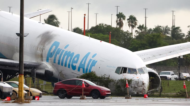 An Amazon cargo plane sits at Miami International Airport after overshooting a runway on Monday, Sept. 7, 2026, in Miami. (AP Photo/David Santiago)