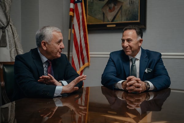 Union Pacific CEO Jim Vena (left) and Norfolk Southern CEO Mark George speak during the Railway Age’s Next Generation Freight Rail conference at the Union League Club of Chicago on Tuesday, March 10, 2026. The companies announced in July 2025 an agreement to create the nation’s first transcontinental railroad. (Jamie Kelter Davis for the AJC)