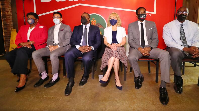 080421 Atlanta: Mayoral candidates Council President Felicia Moore (from left), Councilman Antonio Brown, former Atlanta Mayor Kasim Reed, attorney Sharon Gay, Councilman Andre Dickens, and local businessman Richard Wright take part in a mayoral debate hosted by The Young Democrats of Atlanta at Manuel’s Tavern on Wednesday, August 4, 2021, in Atlanta.   “Curtis Compton / Curtis.Compton@ajc.com”