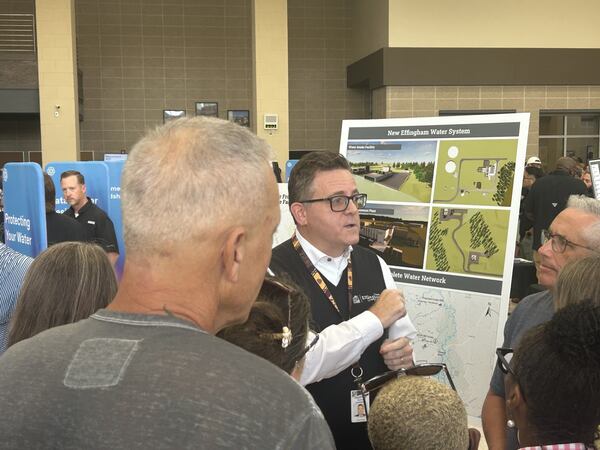 Effingham County administrator Tim Callanan speaks to concerned residents during OpenAI’s data center open house. The project was announced less than 36 hours before Thursday’s meeting. (Adam Van Brimmer/AJC)