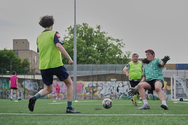 Paula Griffin, right attempt to make a save during an inclusive six a side soccer friendly tournament in London, Sunday, June 1, 2025. (AP Photo/Alastair Grant)