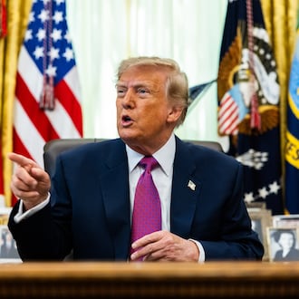President Donald Trump speaks to reporters in the Oval Office on Thursday, Aug. 27, 2026. His administration has issued new proposed rules that would strip private schools of their tax-exempt status if they enact programs that help minority students. (Demetrius Freeman/The New York Times)