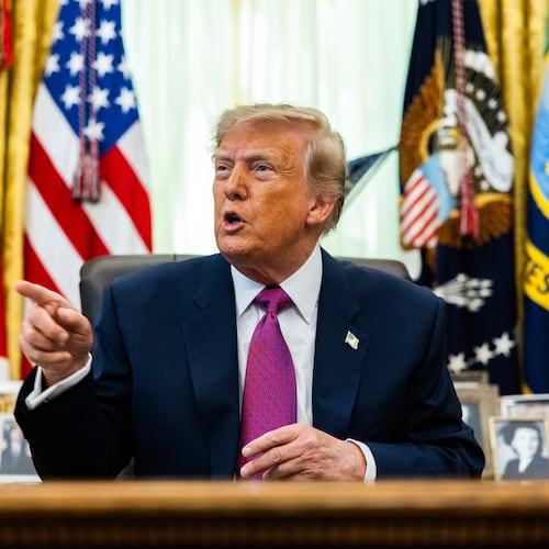 President Donald Trump speaks to reporters in the Oval Office on Thursday, Aug. 27, 2026. His administration has issued new proposed rules that would strip private schools of their tax-exempt status if they enact programs that help minority students. (Demetrius Freeman/The New York Times)