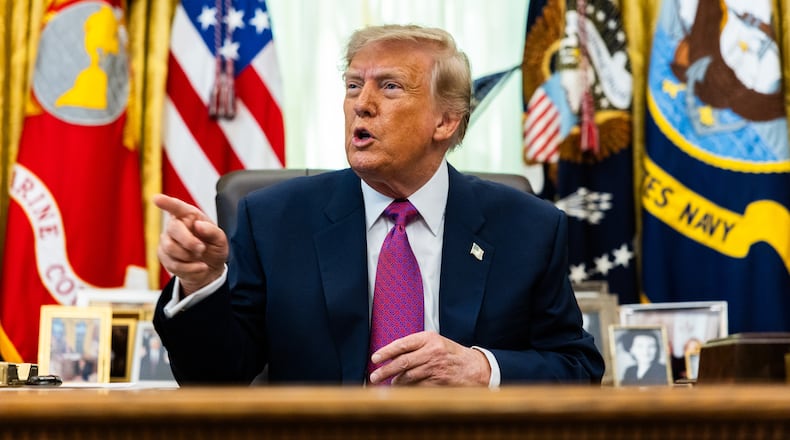 President Donald Trump speaks to reporters in the Oval Office on Thursday, Aug. 27, 2026. His administration has issued new proposed rules that would strip private schools of their tax-exempt status if they enact programs that help minority students. (Demetrius Freeman/The New York Times)