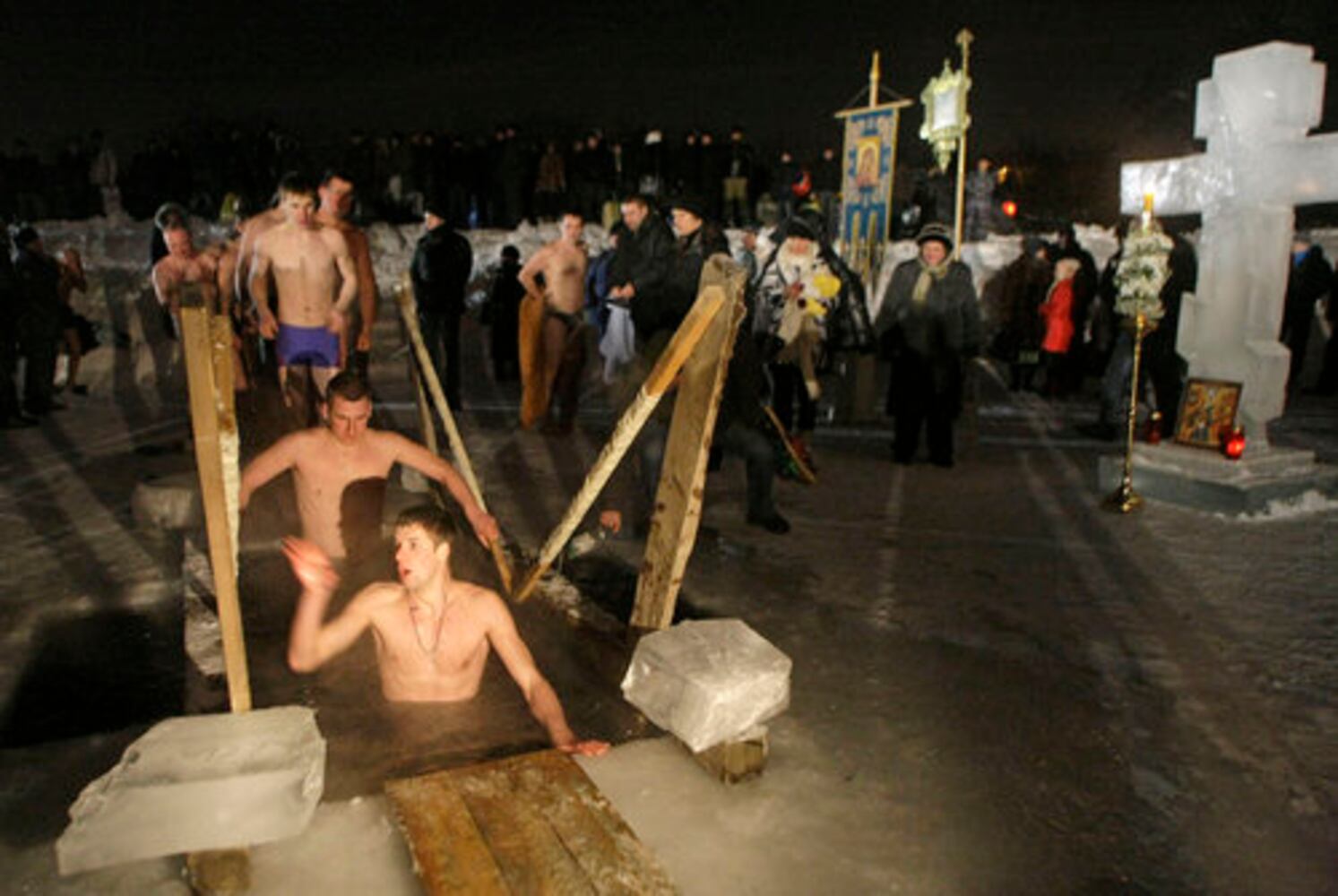 Think it's cold? Russians plunge into ice bath