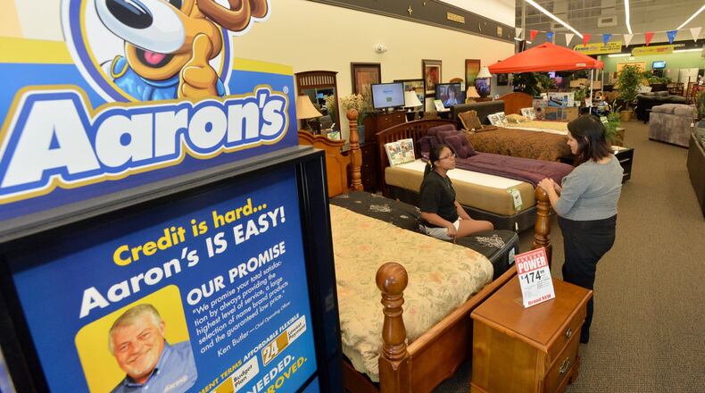 Metro Atlanta-based rental giant Aaron’s, shown in this 2013 photo, leases furniture, appliances and electronics to customers around the nation and in Canada. Recently the company was sued in Cobb County over claims that it sold a bill collector accounts that weren’t valid. HYOSUB SHIN / HSHIN@AJC.COM