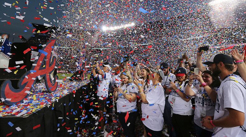 Fans celebrate after the Atlanta Braves defeated the Detroit Tigers, 1-0, in a baseball game, Sunday, Oct. 2, 2016, in Atlanta. The game was the final contest to be played at Turner Field, as the Braves move to new ballpark for the 2017 season. (Curtis Compton/Atlanta Journal-Constitution via AP)