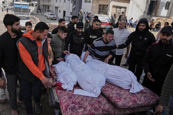 Palestinians accompany the bodies of their relatives killed in an Israeli airstrike, loaded onto a carte in preparation for burial, at Shifa Hospital in Gaza City, Wednesday, April 16, 2025. (AP Photo/Jehad Alshrafi)